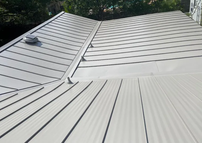 Solar attic fan installed on a metal roof for Roof Ventilation in Cocoa Beach